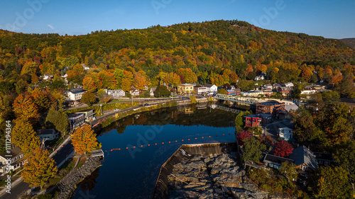 10/12/22 SHEFFIELD FALLS, MA., USA - aerial view at sunrise of Sheffield Falls in autumn, Ma. with Housatonic River running through town, Berkshire Mountains photo