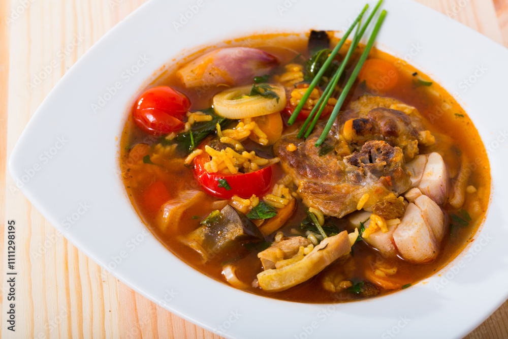 Image of soup of lamb with rice, vegetables, garlic and onion, served in bowl Image of soup of lamb with rice, vegetables, garlic and onion, served in bowl