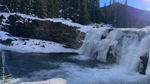 Sheep River Falls in Sheep River Provincial Park - Kananaskis Country - Alberta Canada with fragment of sedimentary rock