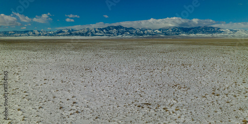 MARCH 2023, HIGHWAY THRU NEVADA, USA - remote Great Basin Mountain Range covered in snow in winter