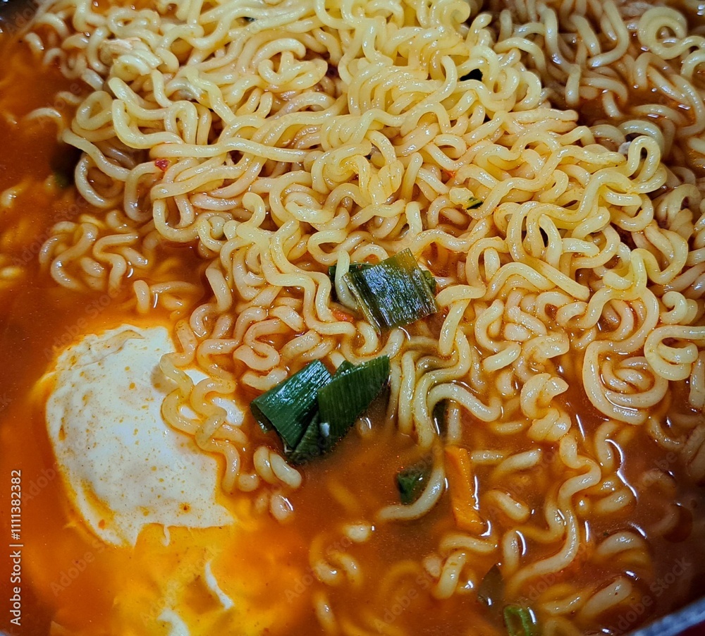 Shin Ramyun,close up of Ramyeon or Ramyun is a Korean-style soup noodle dish with a spicy flavor. Ramyeon or Korean instant noodles with egg - Korean food style
Shin Ramyun,close up of Ramyeon or Ramyun is a Korean-style soup noodle dish with a spicy flavor. Ramyeon or Korean instant noodles with egg - Korean food style