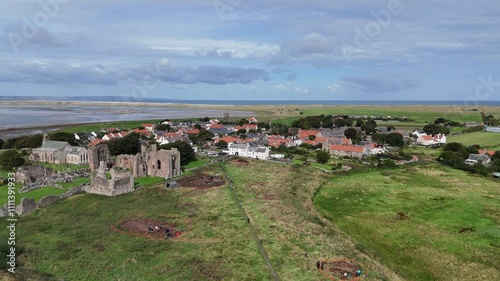 Lindisfarne priory holy island England Panning drone aerial
