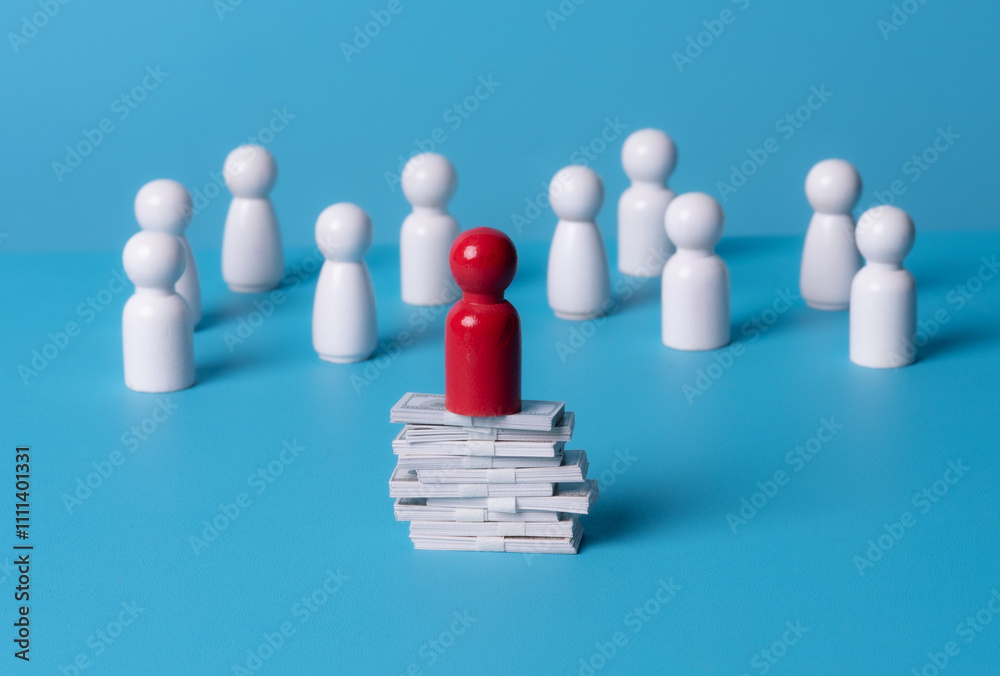 Red wooden figures on stacks of banknote on blue background. Business concept. Red wooden figures on stacks of banknote on blue background. Business concept.