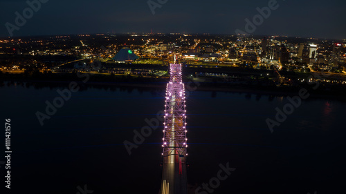 JULY 6, 2023 - MEMPHIS, TN, USA - Hernando De Soto Bridge LIGHT SHOW - Memphis, Tennessee over Mississippi River at night photo