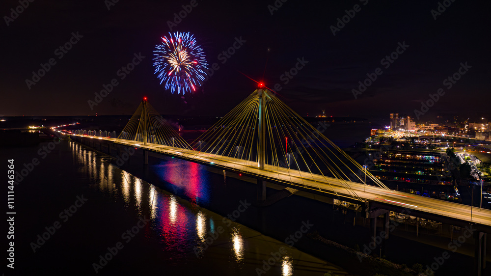 Obraz premium JULY 3, ALTON, IL., USA - July 3 fireworks over Clark Bridge in Alton, Illinois overlooking Mississippi River