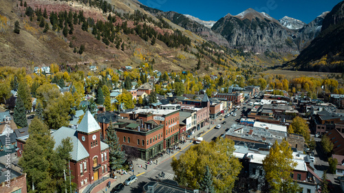Fototapeta Naklejka Na Ścianę i Meble -  OCTOBER 14, 2023 - TELLURIDE COLORADO, USA - aerial view of Main Street old western ski town of Telluride in autumn color surrounded by mountains