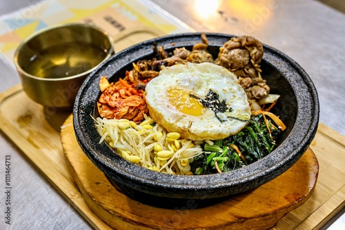 Korean Bibimbap Served in a Hot Stone Bowl photo