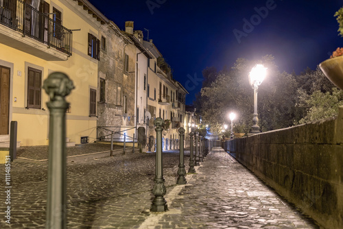 Fototapeta Naklejka Na Ścianę i Meble -  Picturesque cobblestone streets of Castel Gandalfo Italy at night. Italian cityscape