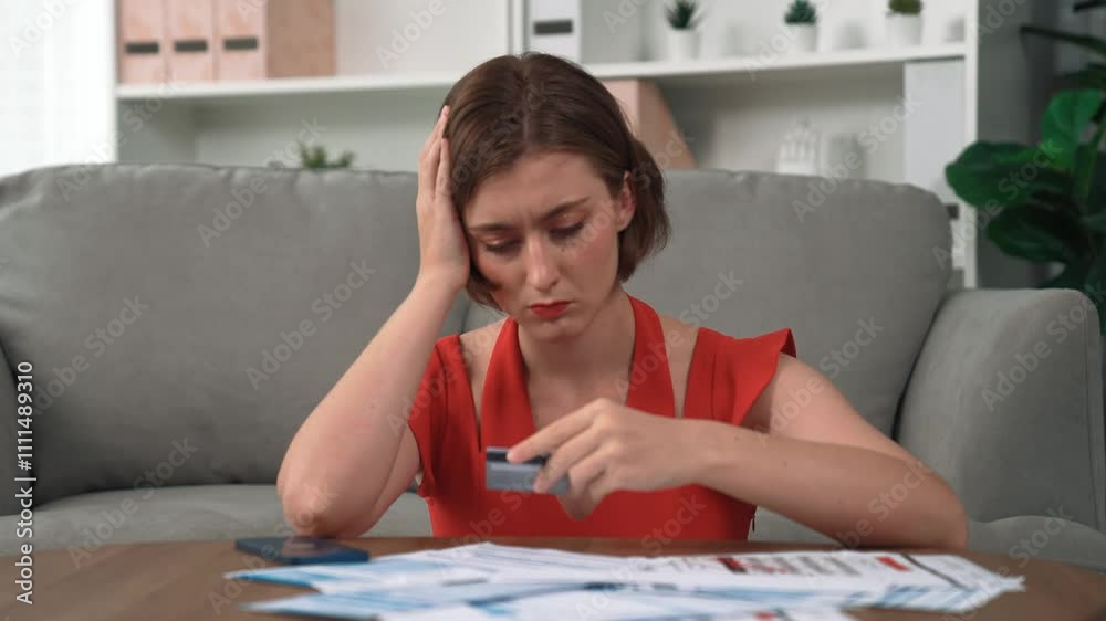 Stressed young woman has financial problems with credit card debt to pay prim from bad personal money and mortgage pay management crisis. Woman worry about financial bankruptcy risk from over spending