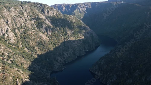 Wallpaper Mural Aerial panoramic pullback above canyon with steep walls and sunlight casting onto trees and rocky landscape Torontodigital.ca
