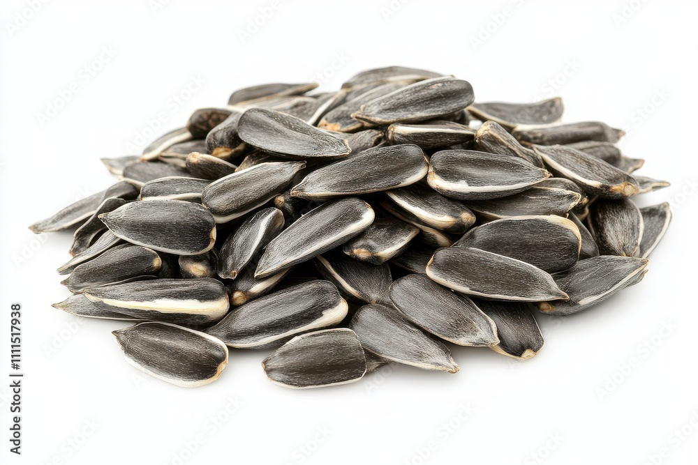 A pile of sunflower seeds isolated on a white background A pile of sunflower seeds isolated on a white background