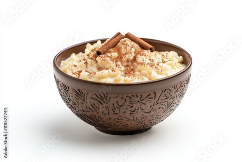 Creamy rice pudding topped with cinnamon in a brown bowl isolated on white background