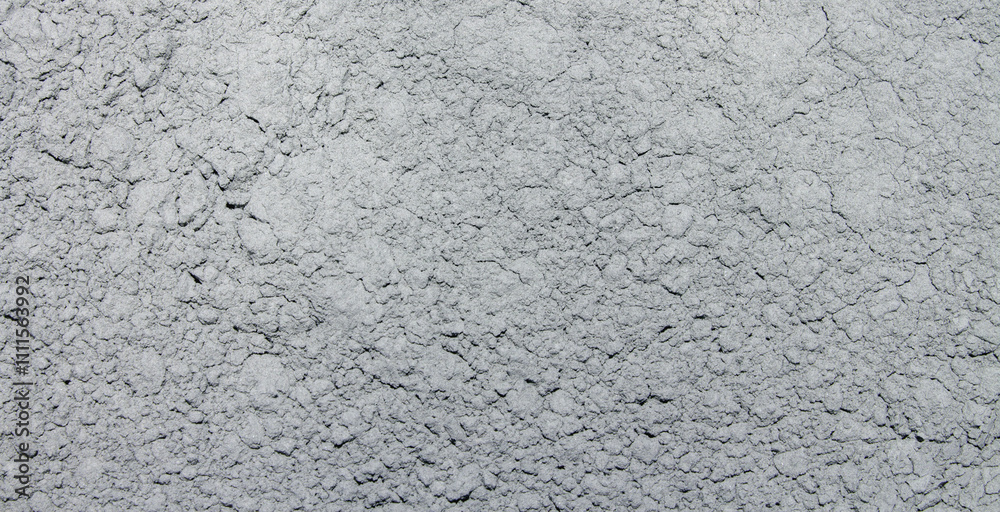Fototapeta premium The texture of the cement.The background is made of cement.The grey cement of the m600 brand is high-strength.