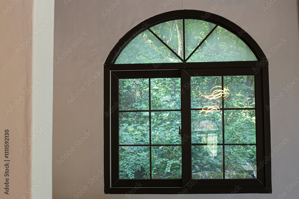 arched windows looking out into a forest arched windows looking out into a forest