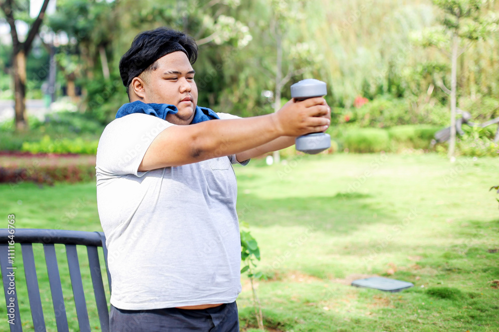 Fat Man in Sportswear Doing Workout Hold Up Dumbbell in The Park
