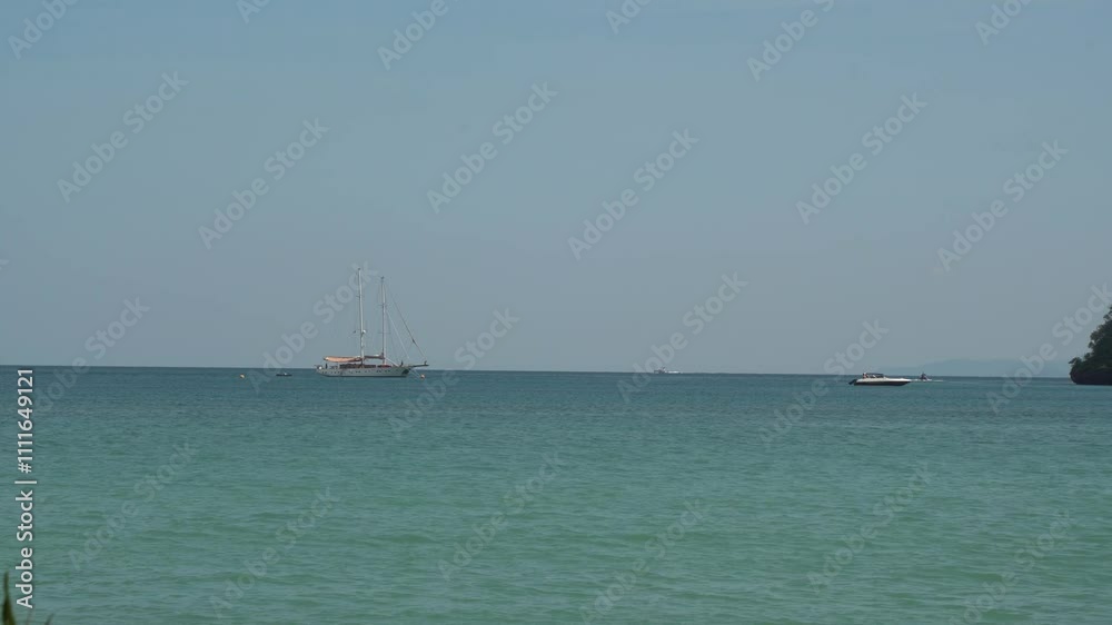 Landscape of Andaman sea and traditional long tail boat with limestone in Railay Ao nang Krabi Thailand - sunny day summer Landscape of Andaman sea and traditional long tail boat with limestone in Railay Ao nang Krabi Thailand - sunny day summer