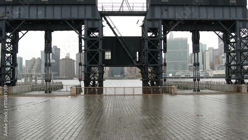 New York City waterfront skyline, Manhattan midtown, riverfront skyscrapers by East river water. Waterside cityscape view from Gantry Plaza dock pier, Long Island, Queens. United States architecture.