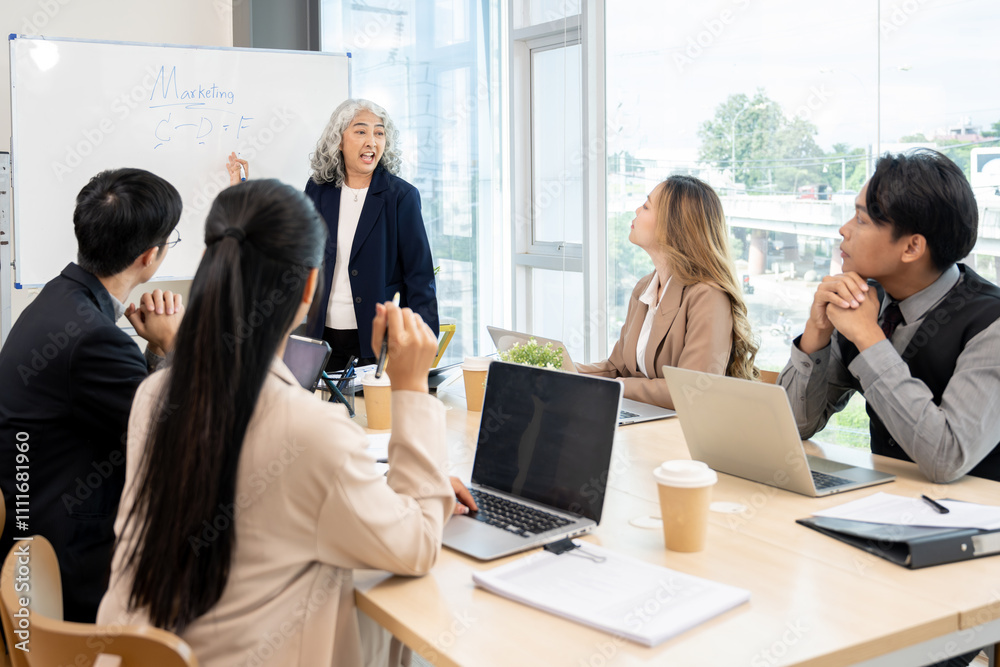 Executives are having a meeting with employees to discuss business planning in a conference room. Executives are having a meeting with employees to discuss business planning in a conference room.