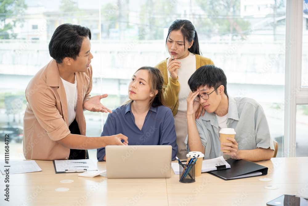 An Asian business startup team brainstorming, sharing creative and helpful ideas, and discussing a project in a modern office. A senior female boss works with young employees in the office. An Asian business startup team brainstorming, sharing creative and helpful ideas, and discussing a project in a modern office. A senior female boss works with young employees in the office.