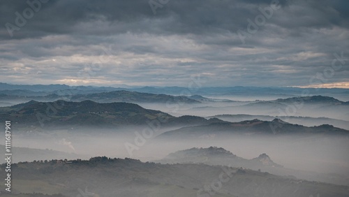 Canvas Print Misty mountains under a dramatic sky