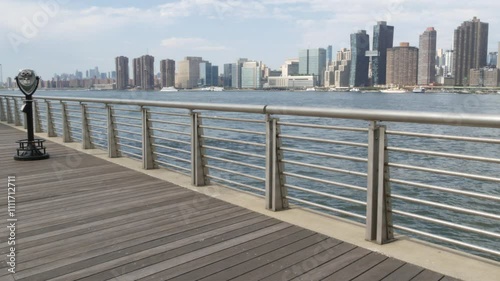New York City waterfront skyline, Manhattan Midtown buildings, riverfront skyscrapers by East river water. Waterside cityscape, tower viewer, Gantry Plaza. Long Island, Queens. United States tourism.