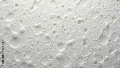 A white surface with many small holes and bubbles