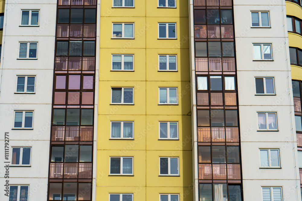 Modern multi-storey house in a new residential complex. The concept of mortgage housing lending and a happy family life. Beautiful multi colored house in the city Modern multi-storey house in a new residential complex. The concept of mortgage housing lending and a happy family life. Beautiful multi colored house in the city