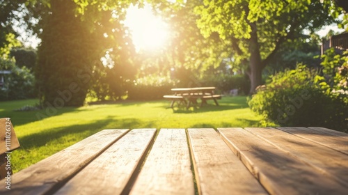 Wooden table with chairs in backyard with green lawn. 