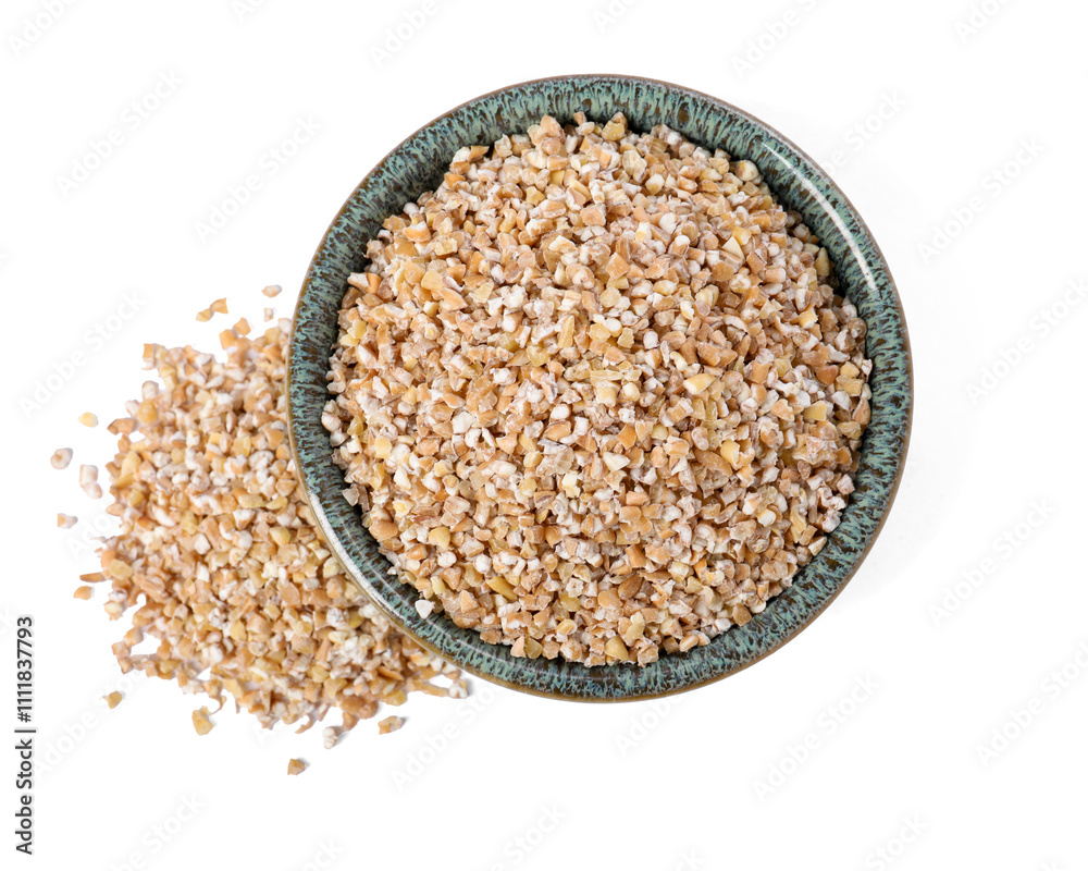 Dry wheat groats in bowl isolated on white, top view Dry wheat groats in bowl isolated on white, top view