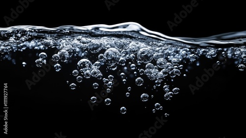 Bubbles rising through clear water with a dark background, creating a serene and tranquil atmosphere. photo