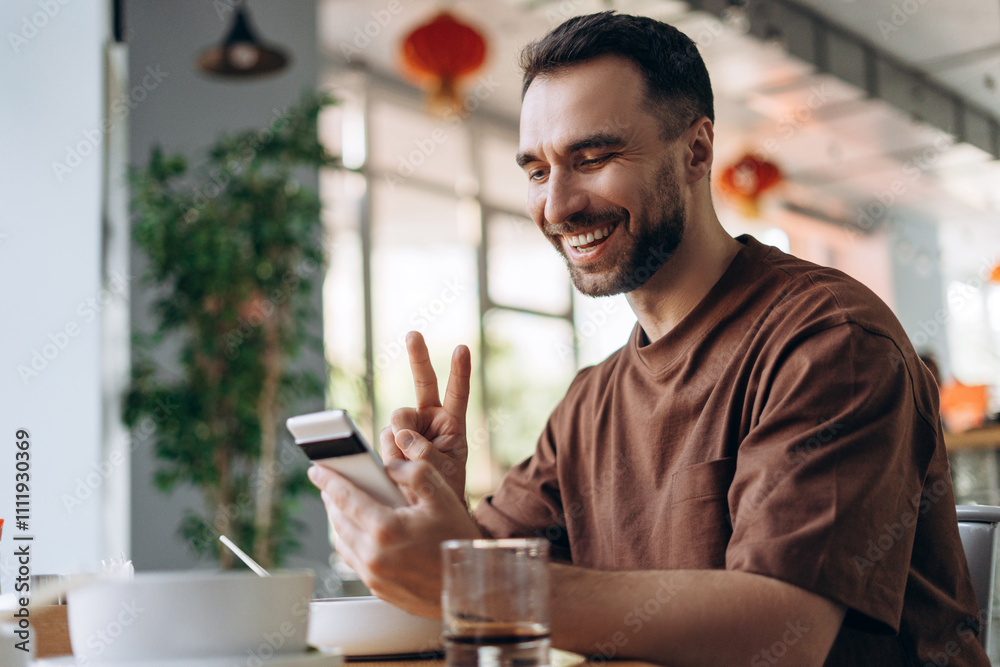 Happy, smiling bearded man holding mobile phone having video call, influencer recording video Happy, smiling bearded man holding mobile phone having video call, influencer recording video