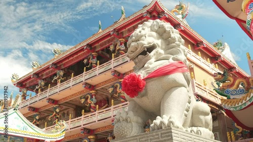 Lion guardian statue in a Chinese temple during a sunny day . Thepsathit Phra Kiti Chalerm Chinese shrine. Bang Saen, Chonburi Thailand Southeast Asia
