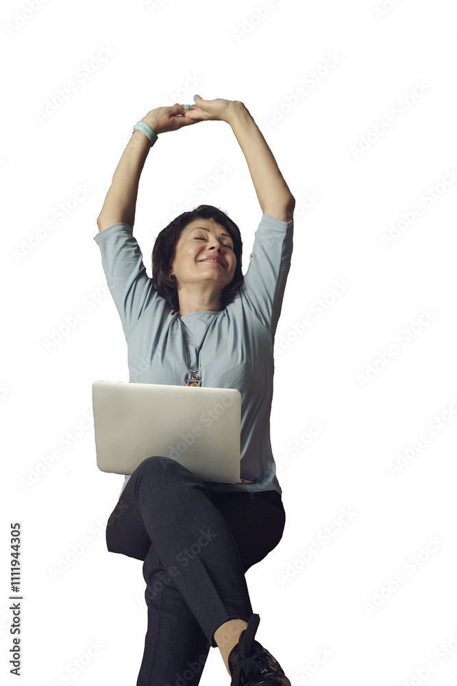adult female brunette businesswoman is sitting on a sofa with a laptop resting with her hands up adult female brunette businesswoman is sitting on a sofa with a laptop resting with her hands up