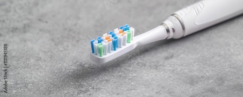 Electric toothbrush emitting vibrant energy waves, text Technology Meets Cleanliness