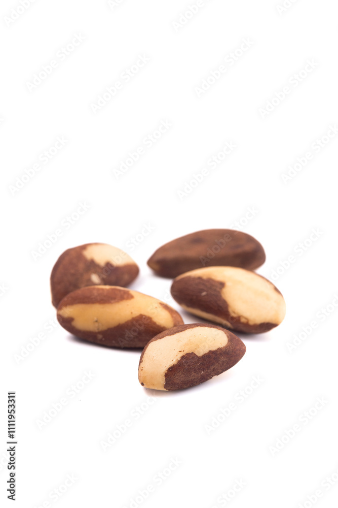 Obraz premium Brazil nuts over white background. Top view. Healthy food concept.