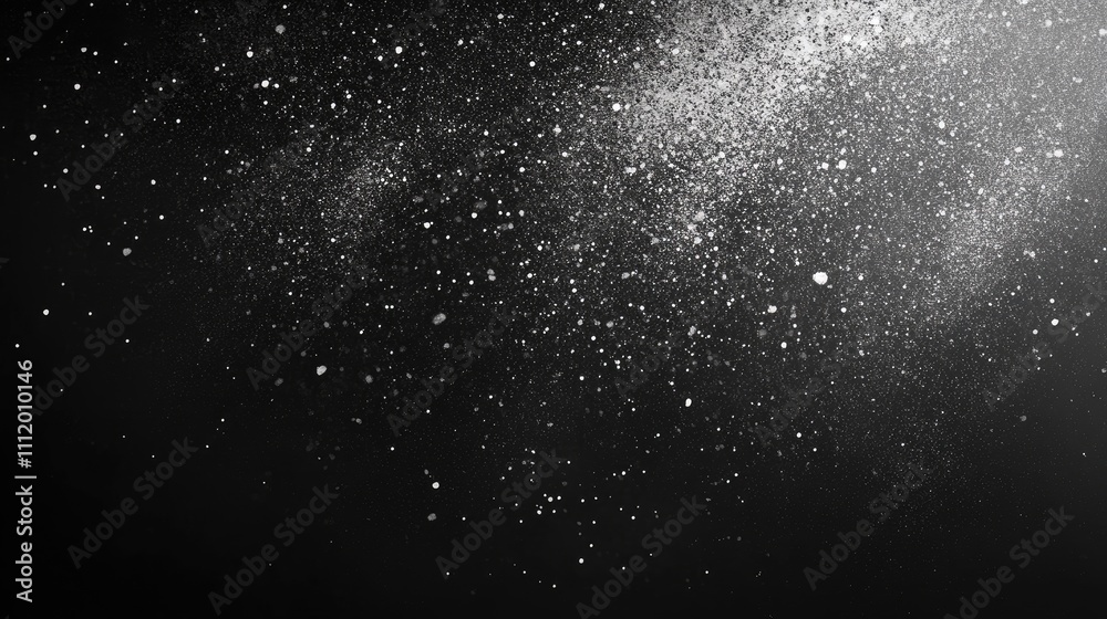 A mesmerizing display of white dust particles shimmering against a black background.