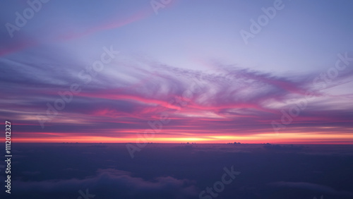 Dusk sky with gradient purple and blue hues, soft clouds drifting across the horizon,  dusk clouds, gradient sky,  blue sky,  serene atmosphere