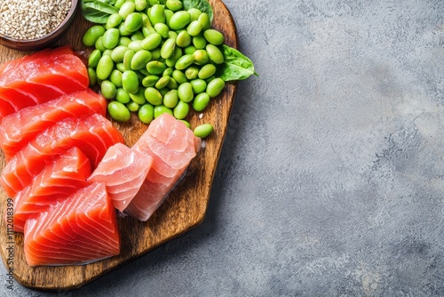 Fresh Cuts of Salmon and Tuna with Edamame on Wooden Platter photo