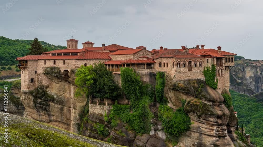 Time lapse with the majestic Varlaam Monastery in the Meteora Valley near Kastraki, Greece Time lapse with the majestic Varlaam Monastery in the Meteora Valley near Kastraki, Greece