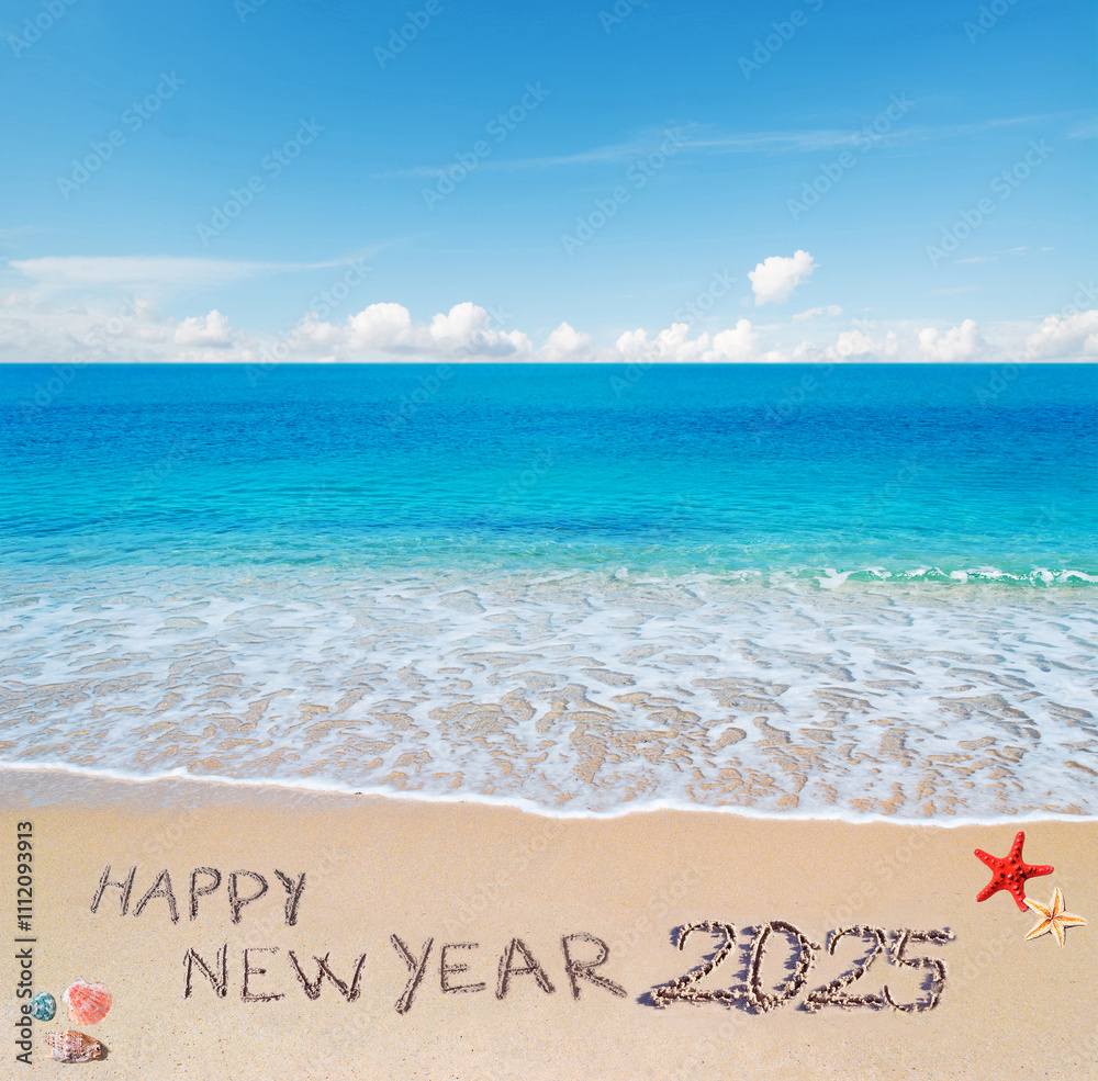 happy new year 2025 written in the sand