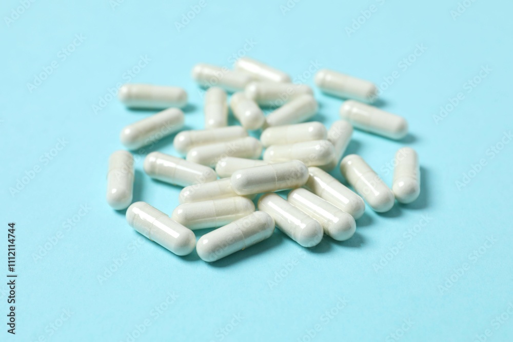 White capsules on color background White capsules on color background