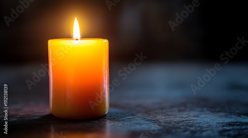 A single lit candle on a dark background.