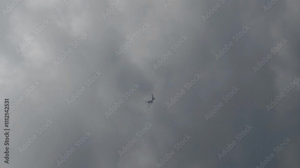 An airplane is flying in the cloudy sky. An airplane is flying in the cloudy sky.