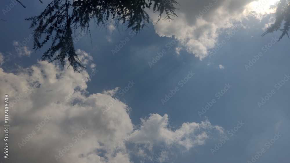 Sky with cloude and sun, summer day background 