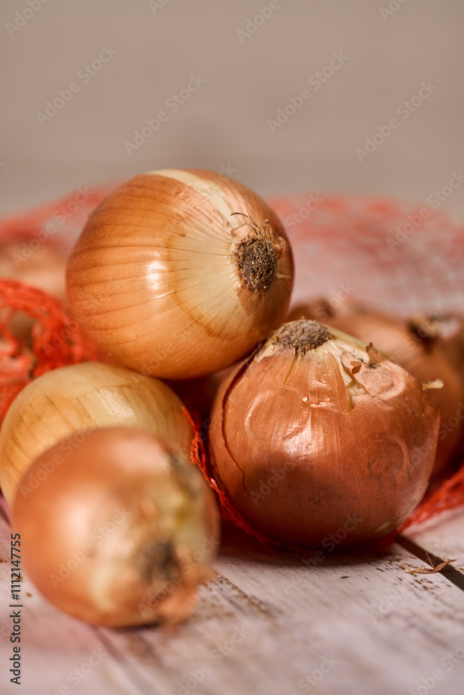 White onions on a wooden board White onions on a wooden board