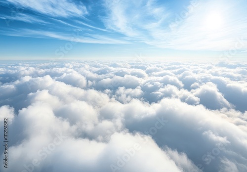 Expansive View of Fluffy White Clouds Against Bright Blue Sky Captured in Daylight, Showcasing Serenity and Tranquility from Above in a High-Altitude Perspective