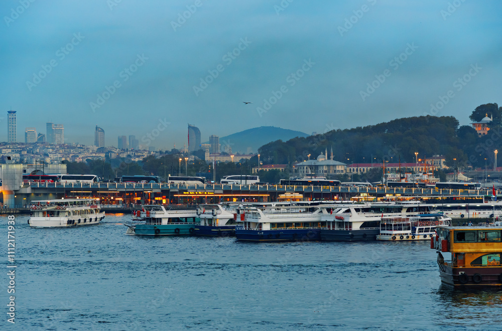 view of the Galata Bridge and ships on the Bosphorus, the cityscape of Istanbul, Turkey, the architecture of the city at sunset, a popular tourist destination. view of the Galata Bridge and ships on the Bosphorus, the cityscape of Istanbul, Turkey, the architecture of the city at sunset, a popular tourist destination.