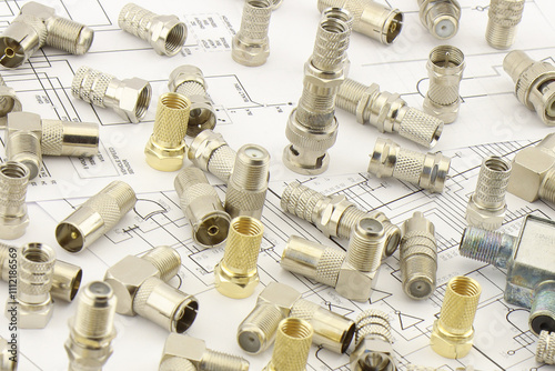 Metal F-connectors for connecting coaxial cable. Close-up. Soft focus.
