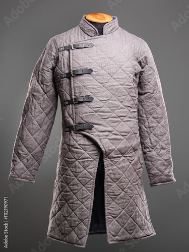 Historical fashion. Medieval knight cloth. Padded jacket gambeson. photo