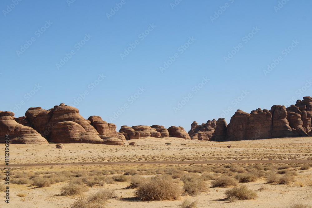A beautiful view of thousands of years old rocks in the archaeological area of AlUla, Madain Saleh in Saudi Arabia. A beautiful view of thousands of years old rocks in the archaeological area of AlUla, Madain Saleh in Saudi Arabia.